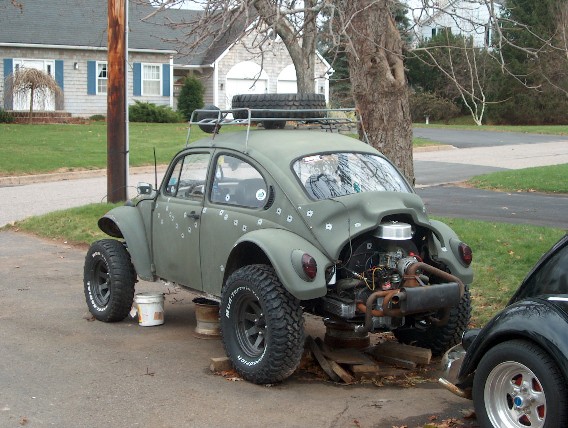 A Beetle sedan typically with fiberglass fenders and a hood that has been