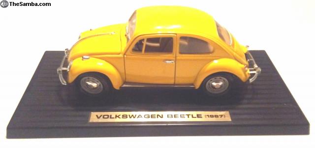 yellow volkswagen beetle toy car