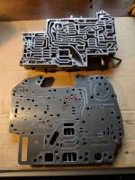 Valve body separation plate, transfer plate