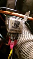 electrical part bolted to ignition coil bracket