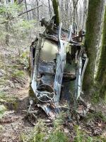 Rusty Bug with iron cross abandoned on local mountain