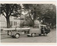 Logo Pick Up with timber carrying trailer