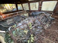 FOUND:  Sitting since 1971, 23 Window Bus out in the woods!