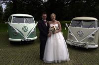 Me and my wife by the wedding cars