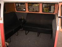 Interior remodelling bay window seats in a split bus